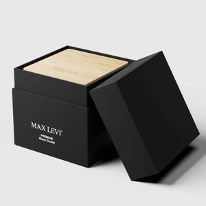 Max Levi Premium Black Orchid Scented candle in gift box with open lid.
